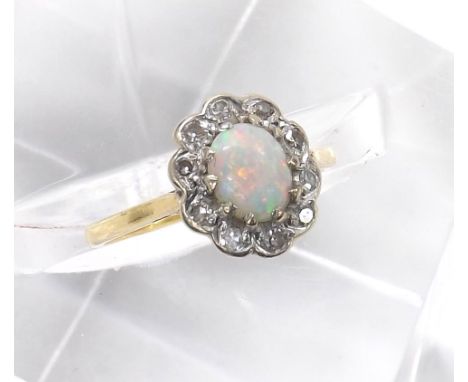 18ct opal and diamond oval cluster ring, cluster 11mm x 9mm, London 1964, 2.7gm, ring size J