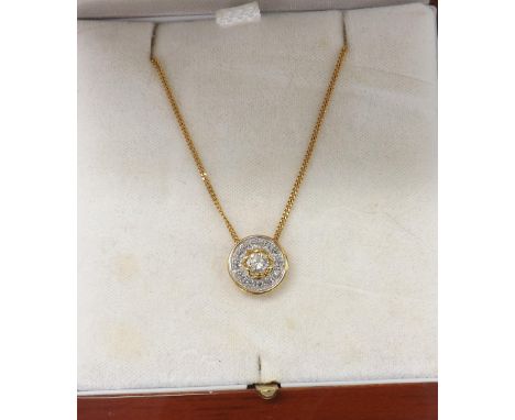 18ct circular target style pendant, the central stone 0.42ct approx, clarity SI1-2, colour J-K, within a diamond cluster sett