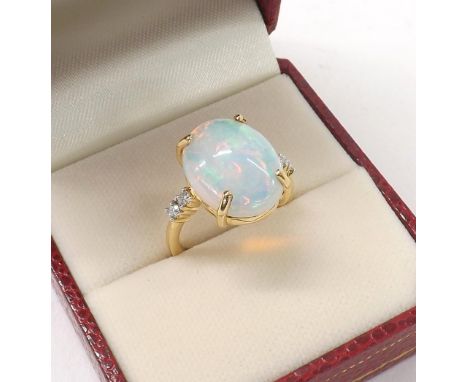 Iliano 18ct yellow gold opal and diamond ring, the oval cabouchon opal 6.82ct, flanked by two round brilliant-cut diamonds, 6