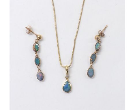 14k yellow gold doublet opal pendant on necklet; together with a pair of three stone drop earrings, 5.8gm 