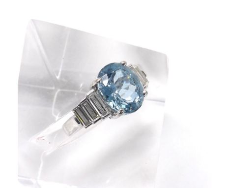 18ct white gold aquamarine and diamond ring, the oval aquamarine 3.90ct approx, in a stepped setting with three baguette diam