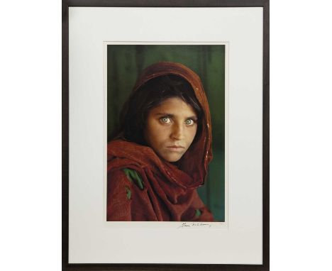 STEVE MCCURRY (AMERICAN b. 1950),SHARBAT GULA, AFGHAN GIRL, PAKISTAN offset lithographic colour print, signed in pen lower ri