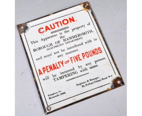 A small reproduction enamel caution sign for the electricity department borough of Hammersmith. The sign having white ground 