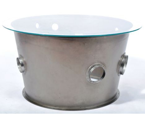 An industrial aviation bespoke coffee table / side occasional table made from the engine casing / heat shield of a Red Arrows