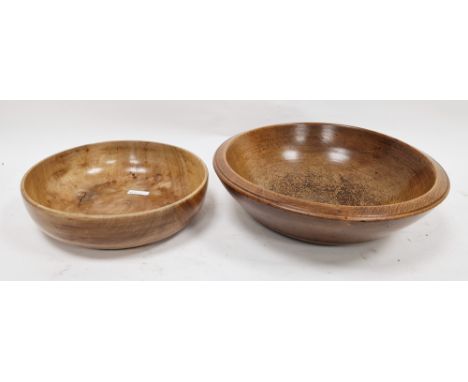 Two treen bowls in sizes, the first, turned, 19th century 36cm diam. and a smaller polished bowl 27.7cm diam. (2)Condition Re
