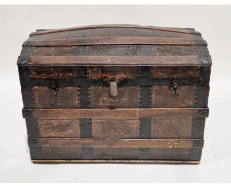 19th century wooden domed top travelling trunk or chest, iron bound with leather mounts, the hinged lid opening to a lift-out