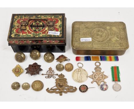 Collection of military items including a Queen Mary 1914 Christmas tin, two World War I medals awarded to 2625 Pte. C. Anstis