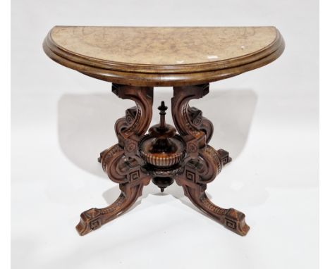 Victorian figured walnut demi-lune card table, the inlaid fold-over top opening to a burgundy playing surface, on four shaped