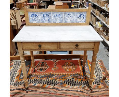 Late 19th century stripped pine marble-topped washstand&nbsp;with tile top mount, two short drawers, raised on turned legs wi