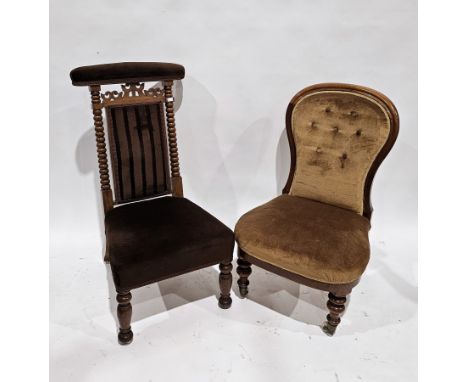 19th century oak prie-dieu chair with carved pierced back rail and bobbin supports, upholstered in brown fabric, on turned ba