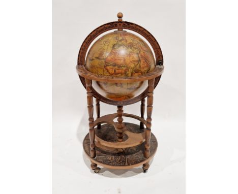 20th century Italian style terrestrial globe cocktail cabinet, the hinged lid opening to a fitted interior, the base with com