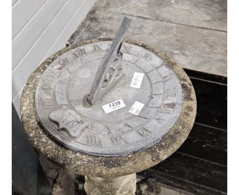 Lead garden sundial set on a composite stone circular plinth base moulded with vines, on a scrolling shaped base, 87cm high