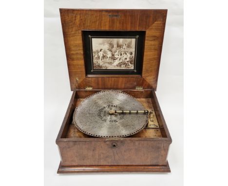 19th century German symphonion&nbsp;in figured walnut case, the hinged with floral inlaid panel, the interior of the lid inse