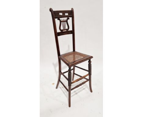 19th century child's music chair, with bar back, lyre-shaped splat and cane seat, on tall turned bobbin carved legs, 98cm hig