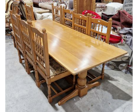 Pale oak dining room suite comprising a refectory table in the 17th century manner, the plank top on two baluster turned supp