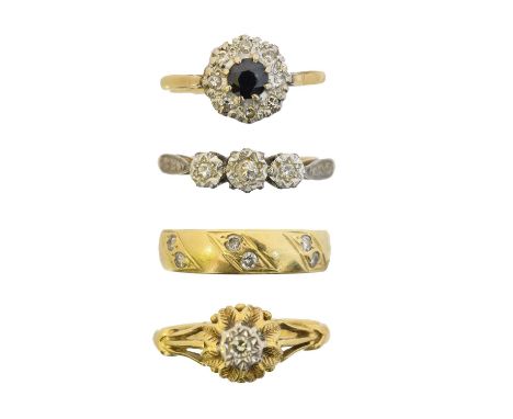 Four 18ct gold dress rings, to include a diamond single stone ring, a sapphire and diamond cluster ring, a diamond three ston