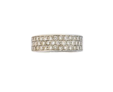 A platinum diamond band ring, the three brilliant cut diamond lines inset to the polished band, estimated total diamond weigh