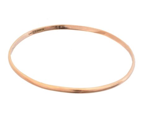 A 1920s 9ct gold bangle, hallmarks for E Whitehouse &amp; Son, Chester, 1924, inner diameter 8.3cm, gross weight 18.1g.Condit