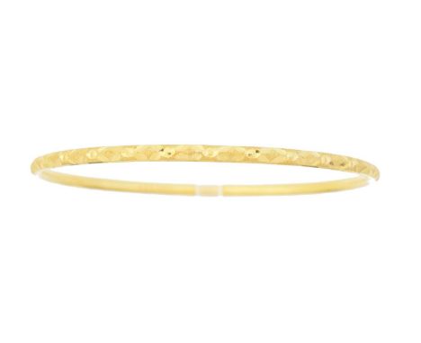 A bangle, with engraved pattern throughout, stamped 22c, inner diameter 6.7cm, gross weight 8.5g.Condition report: Overall co