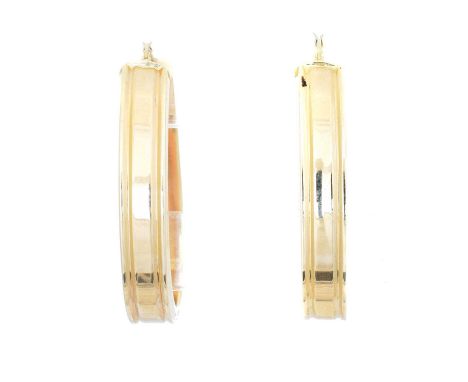 A pair of hoop earrings, each with grooved detailing, stamped 14K, length 4.7g, gross weight 6.6g.Condition report: Overall c