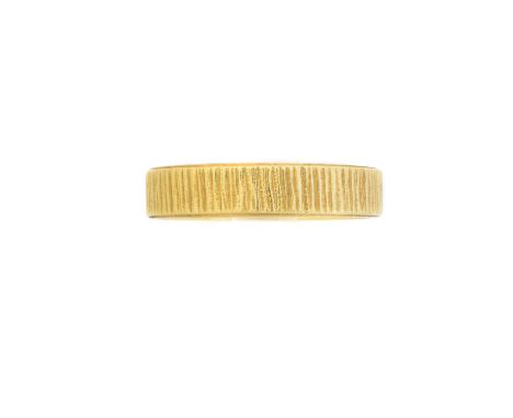 An 18ct gold textured band ring, hallmarks for London, 1979, ring size Q1/2, gross weight 4.1g.Condition report: Overall cond