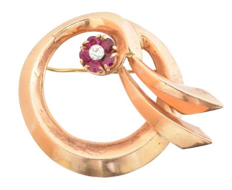 A mid 20th century ruby and diamond brooch, the old cut diamond and circular shape ruby cluster set atop the polished ribbon 