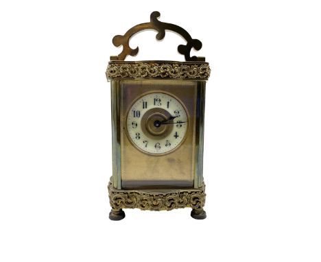 French - Edwardian 8-day carriage clock in a  Louis XV Doucine case, with overlaid friezes and gilt repousse work, gilt dial 