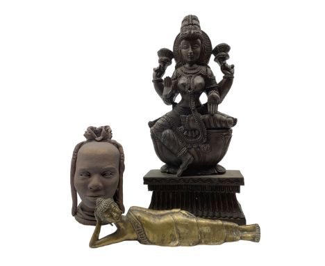 Large Indian carved wooden figure depicting the goddess lakshmi, H62cm, a brass figure of a reclining Buddha and an African p