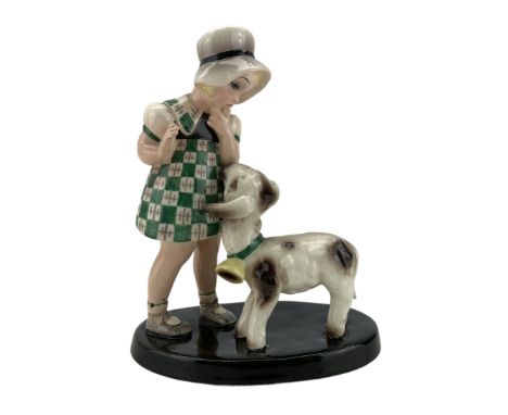 1930s Goldscheider pottery figure group modelled as a young girl wearing a green chequered dress looking down towards a lamb 