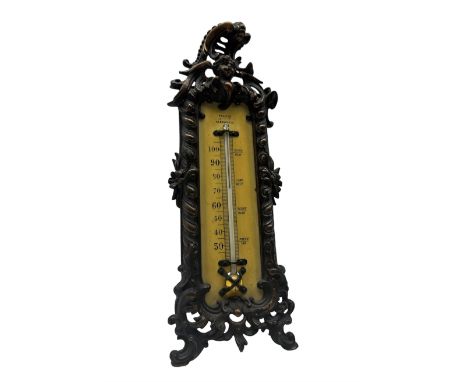 Early 20th century desk thermometer by Franks, Deangate, Machester, with ivorine panel and ornate cast iron frame, surmounted