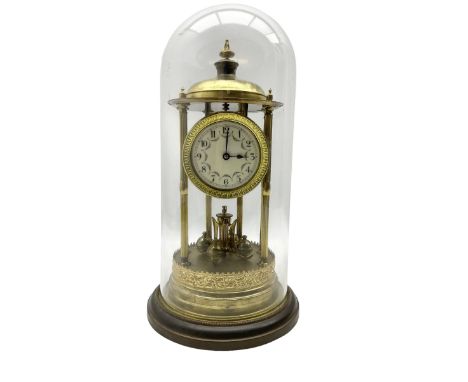 Early 20th century portico "bandstand" torsion clock - with a glass dome, six reeded pillars and circular brass base, enamel 
