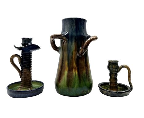 Three pieces of Art Nouveau pottery, probably Belgian, comprising a three-handled vase H28cm of tapered form, candlestick and