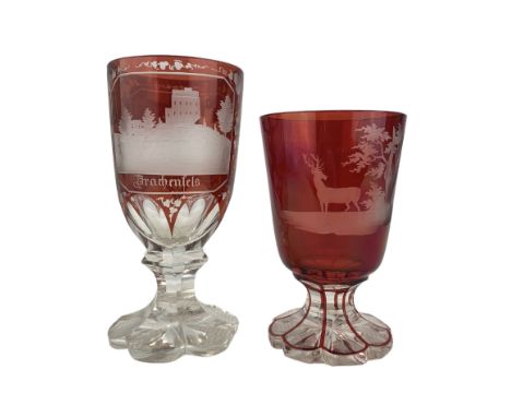 19th century Bohemian ruby overaly glass goblet, the funnel bowl engraved with a Stag in a woodland landscape, on faceted foo