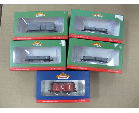 Four 1:76 Scale Narrow gauge Wagons, by Bachmann, plus a "OO" Scale Seven plank Wagon by Bachmann, all boxed, as new.
