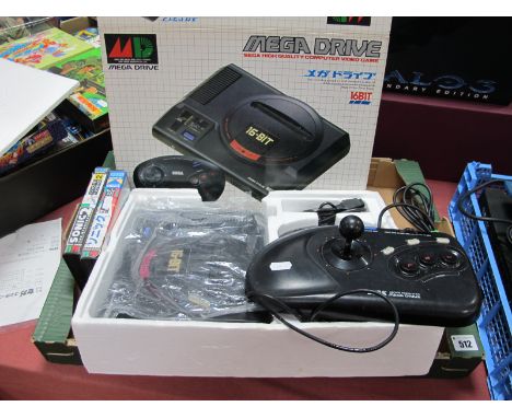 A Boxed Sega Mega Drive 16 Bit Gaming Console, S/No A10421265, including one control pad, instructions (Japanese), Asian Mark