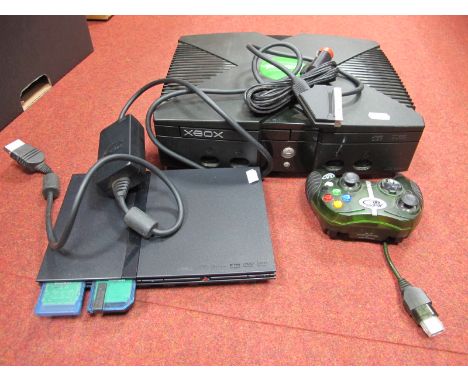 An Original Microsoft X Box Gaming Console, Madcatz controller, Sony Playstatin 2 'Slim' edition gaming console, memory cards
