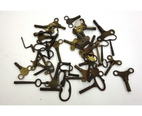 A collection of forty brass and steel mantel, bracket, carriage and longcase clock keys, 19th/20th century.