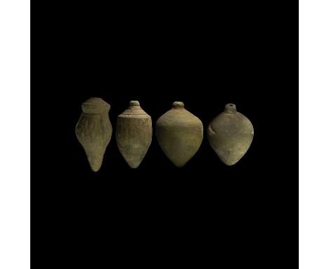 9th-11th century AD. A group of four hollow ceramic vessels each with conical body, intended to be filled with explosive liqu