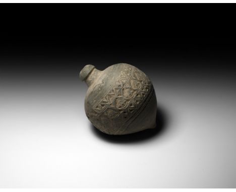 9th-11th century AD. A ceramic bulbous vessel with domed top and flat base, intended to be filled with explosive liquid and w