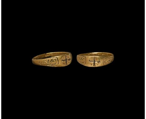 12th-13th century AD. A gold finger ring with scrolled tendrils to the shoulders, plaque with cross fleury motif. Cf. Chadour