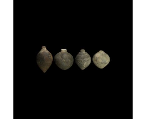 9th-11th century AD. A group of four hollow ceramic vessels each with conical body, intended to be filled with explosive liqu