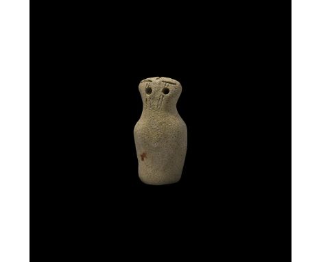 2nd millennium BC. A drum-shaped stone idol with tapering head, recessed eyes and slit eyebrows.   28.1 grams, 49mm (2"). Pro