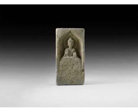 Northern Wei Dynasty, 386-534 AD. A ceramic brick with seated Buddha figure in high relief within an ogee niché, nimbus behin