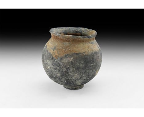 3rd-2nd millennium BC. A ceramic storage jar with bulbous body, flared rim.   1.4 kg, 19.5cm (7 3/4"). From the property of a