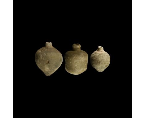 9th-11th century AD. A group of three hollow ceramic vessels each with conical body, intended to be filled with explosive liq