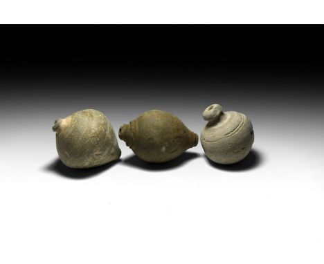 9th-11th century AD. A group of three hollow ceramic vessels two with conical body, one with a bulbous body, intended to be f