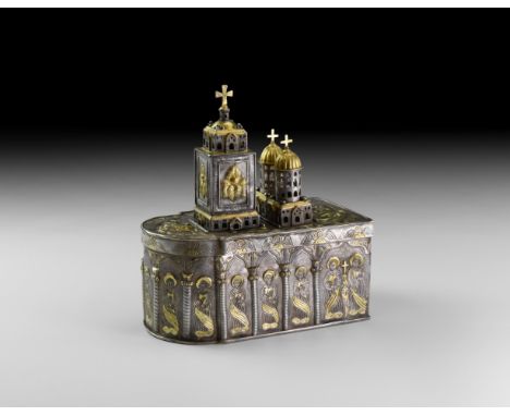 18th century AD. A substantial parcel-gilt silver reliquary formed as a rectangular body with apsidal end; repoussé arcade to