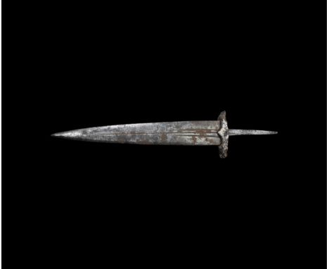 16th century AD. An iron basler dagger with lozenge-section triangular blade, with blood channels, elongated triangular grip;