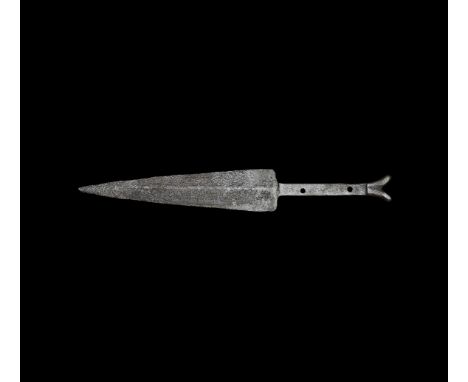 13th-14th century AD. A hand-forged iron scale-tang dagger with lentoid-section triangular blade, tang pierced in two places,