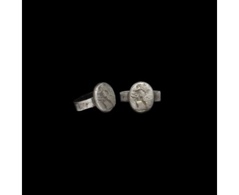 1st-2nd century AD. A silver finger ring with integral ellipsoid bezel, intaglio advancing figure with helmet and spear.   4.
